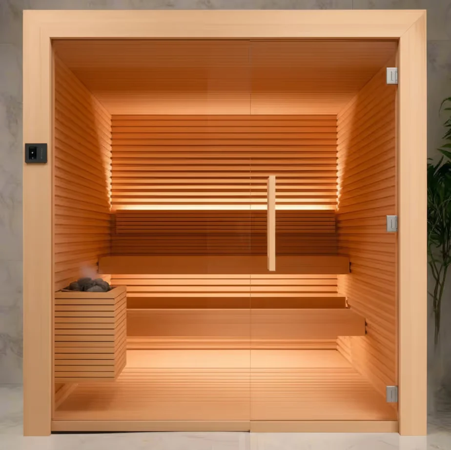 A timber sauna interior with pale benches and a stone-filled heater.
